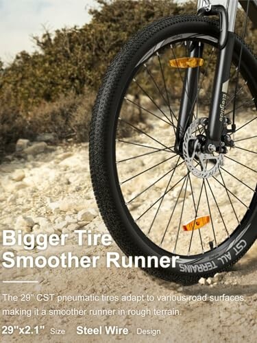 Bicycle with large tire on rocky terrain, perfect for off-road adventures.